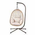 Chaise suspendue en rotin avec coussins beige