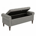 Banc en tissu gris avec rangement et pieds en bois