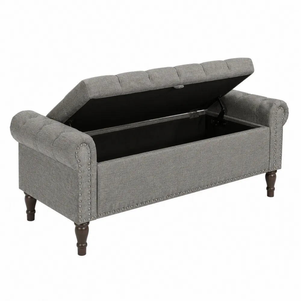 Banc en tissu gris avec rangement et pieds en bois